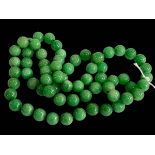 Green jade bead necklace, 80cm length.