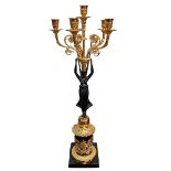 Gilt and ebonised metal ornate six branch candelabra in the form of winged angel supporting candle