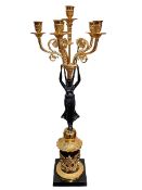 Gilt and ebonised metal ornate six branch candelabra in the form of winged angel supporting candle