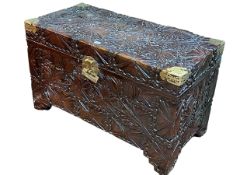 Oriental carved and brass bound camphorwood trunk, 60cm by 100.5cm by 49.5cm.