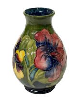 Vintage Moorcroft Pottery anemone vase with warrant label, 19.5cm.