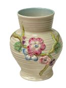 Clarice Cliff vase with raised floral decoration.