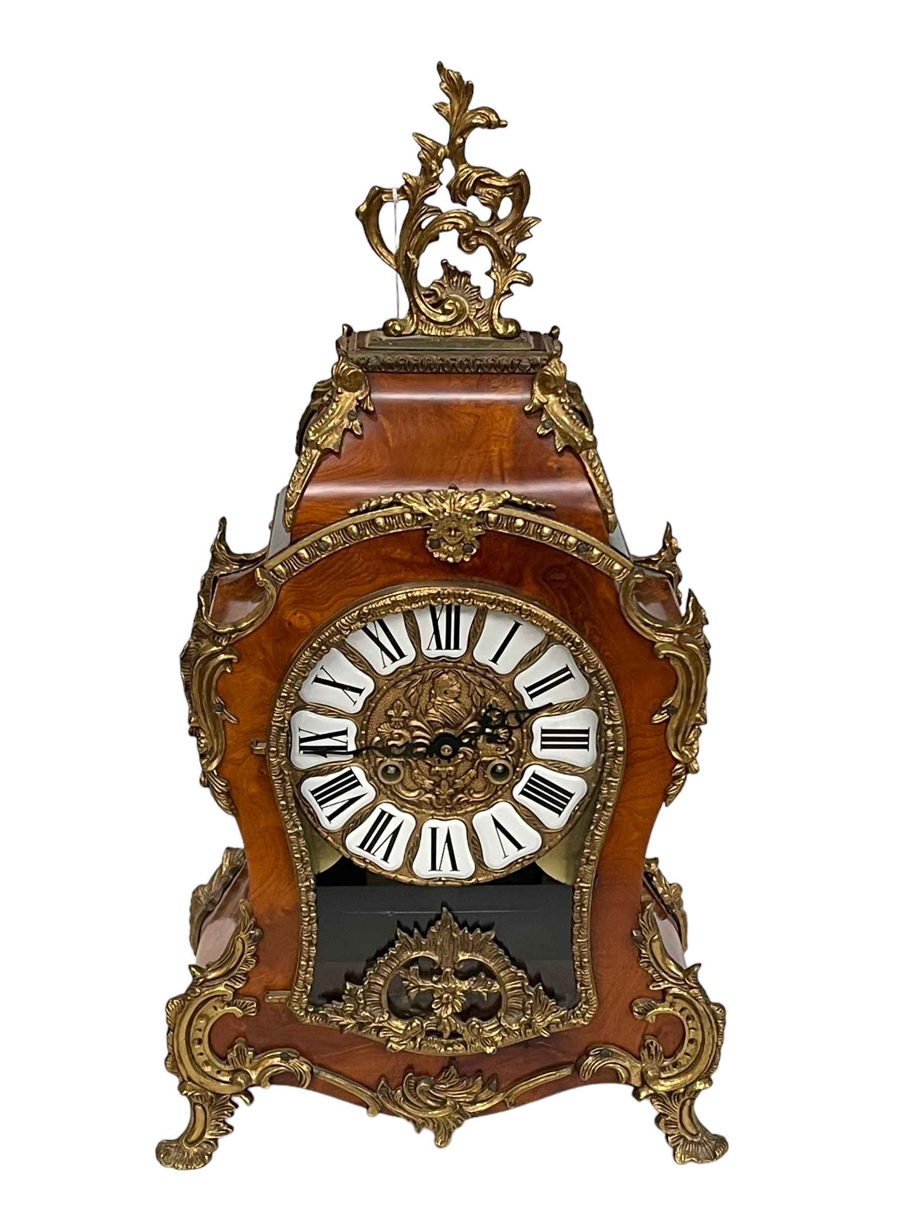 French style ornate walnut and gilt metal mounted mantel clock with enamel Roman numeral dial.