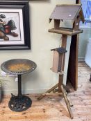 Cast metal bird bath and a wood bird table with feeder.