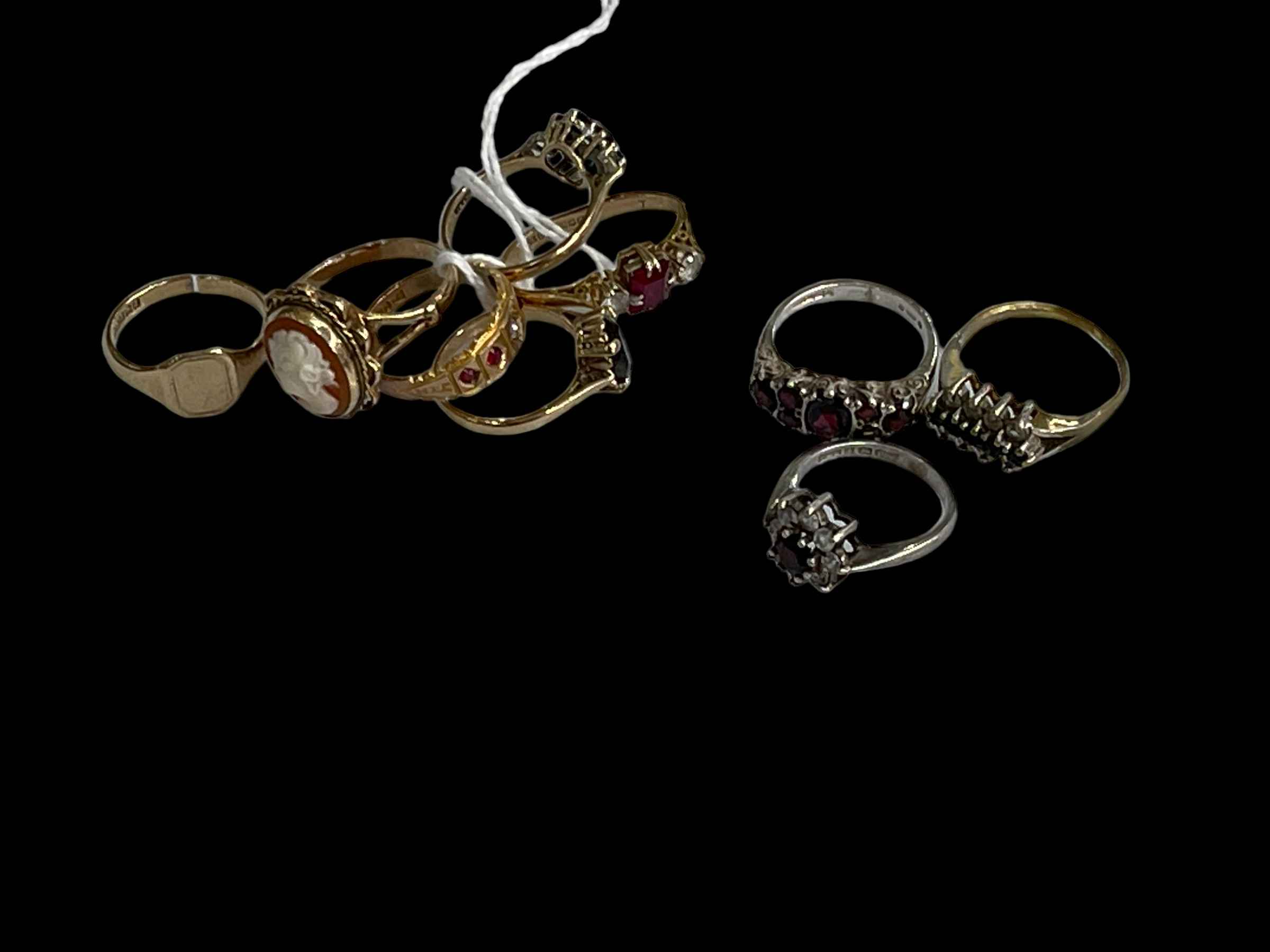 Six 9 carat gold rings and three others.