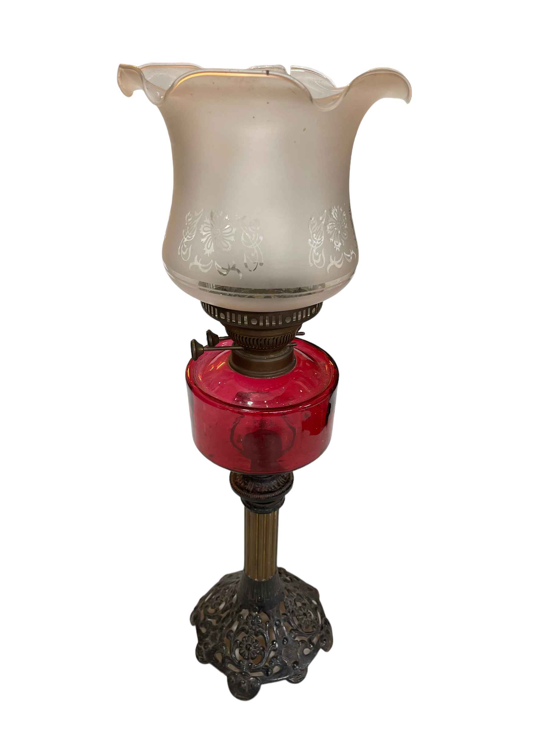 Victorian cast metal and brass oil lamp with ruby reservoir and frosted etched shade.
