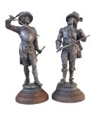 Two cast metal Cavalier sculptures, 51cm highest.