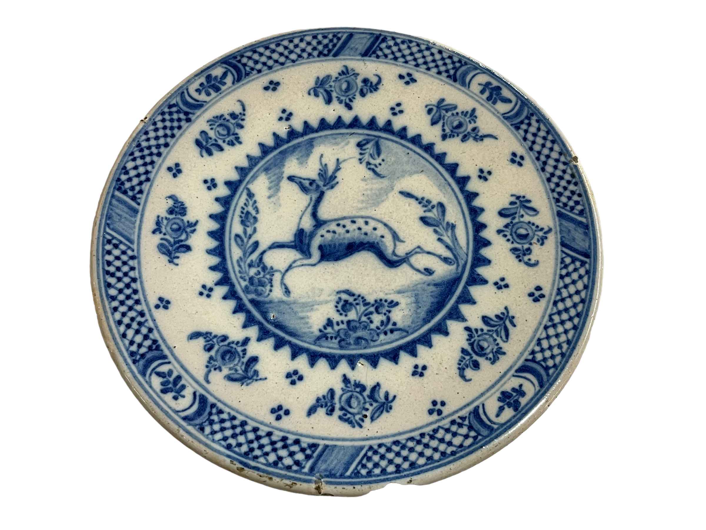 18th Century Persian plate with blue and white decoration.