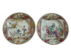 Pair of Chinese famille rose plates decorated with figures and floral borders.