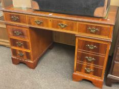 Yew six drawer pedestal desk, 77cm by 122cm by 62cm.