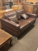 Contemporary chocolate brown leather two seater settee.