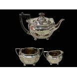 Silver three piece tea set of part fluted oblong form, London 1899.