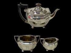 Silver three piece tea set of part fluted oblong form, London 1899.