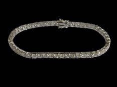 18 carat white gold and diamond tennis bracelet, 17.5cm in length, diamond content 8.06 carats.