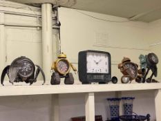 Five novelty clocks.