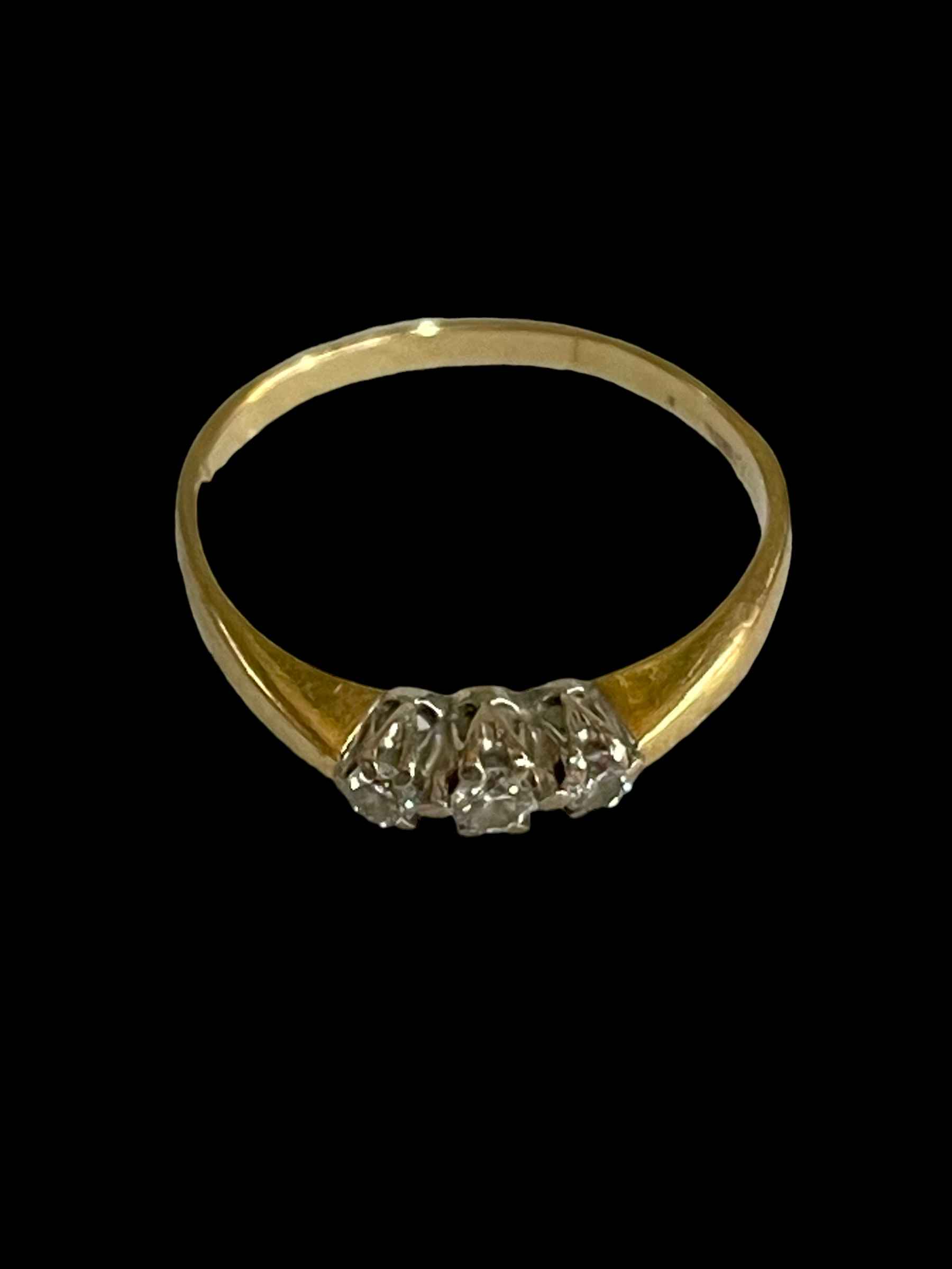 Three stone diamond and 18 carat gold ring, size R.