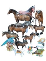 Collection of Beswick horses, birds and other animals.