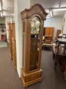 Kieninger oak cased triple weight longcase clock having arched moon phase dial, 208cm.