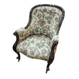 Victorian mahogany framed armchair in buttoned tapestry fabric.