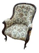 Victorian mahogany framed armchair in buttoned tapestry fabric.