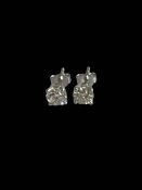 Pair of diamond stud earrings set in 18 carat white gold, diamond content 1.33 carats.