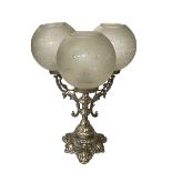 Ornate three branch candelabra with etched glass shades.