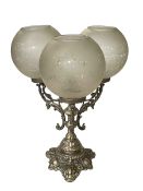 Ornate three branch candelabra with etched glass shades.