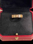 Cartier 18 carat gold and diamond set band ring, signed to interior, purchase date 2015,