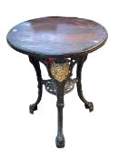 Cast base circular pub table, 70cm by 61cm diameter.