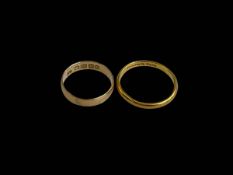 Two 18 carat and 22 carat gold wedding bands.