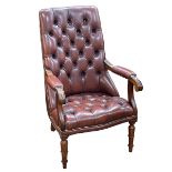 Brown buttoned leather and brass studded open armchair.