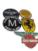 Six cast metal motoring signs.