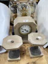 Three anniversary clocks and a stone clock garniture set.