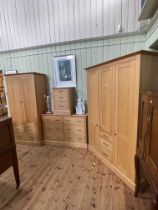 Contemporary golden oak four piece bedroom suite comprising triple door combination wardrobe 201cm