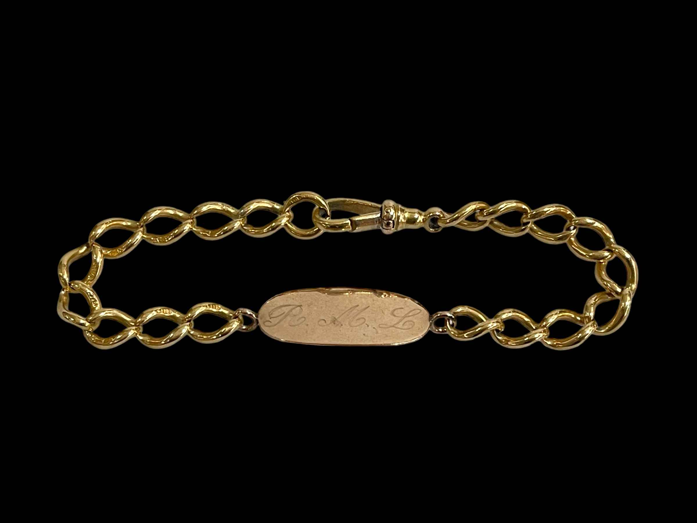 18 carat gold bracelet with signature plaque.