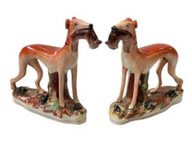 Good pair of Staffordshire greyhounds with hares, 15cm.