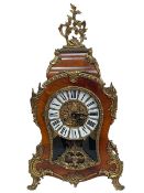 French style ornate walnut and gilt metal mounted mantel clock with enamel Roman numeral dial.