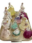 Eight Coalport and three Royal Doulton figurines (11).