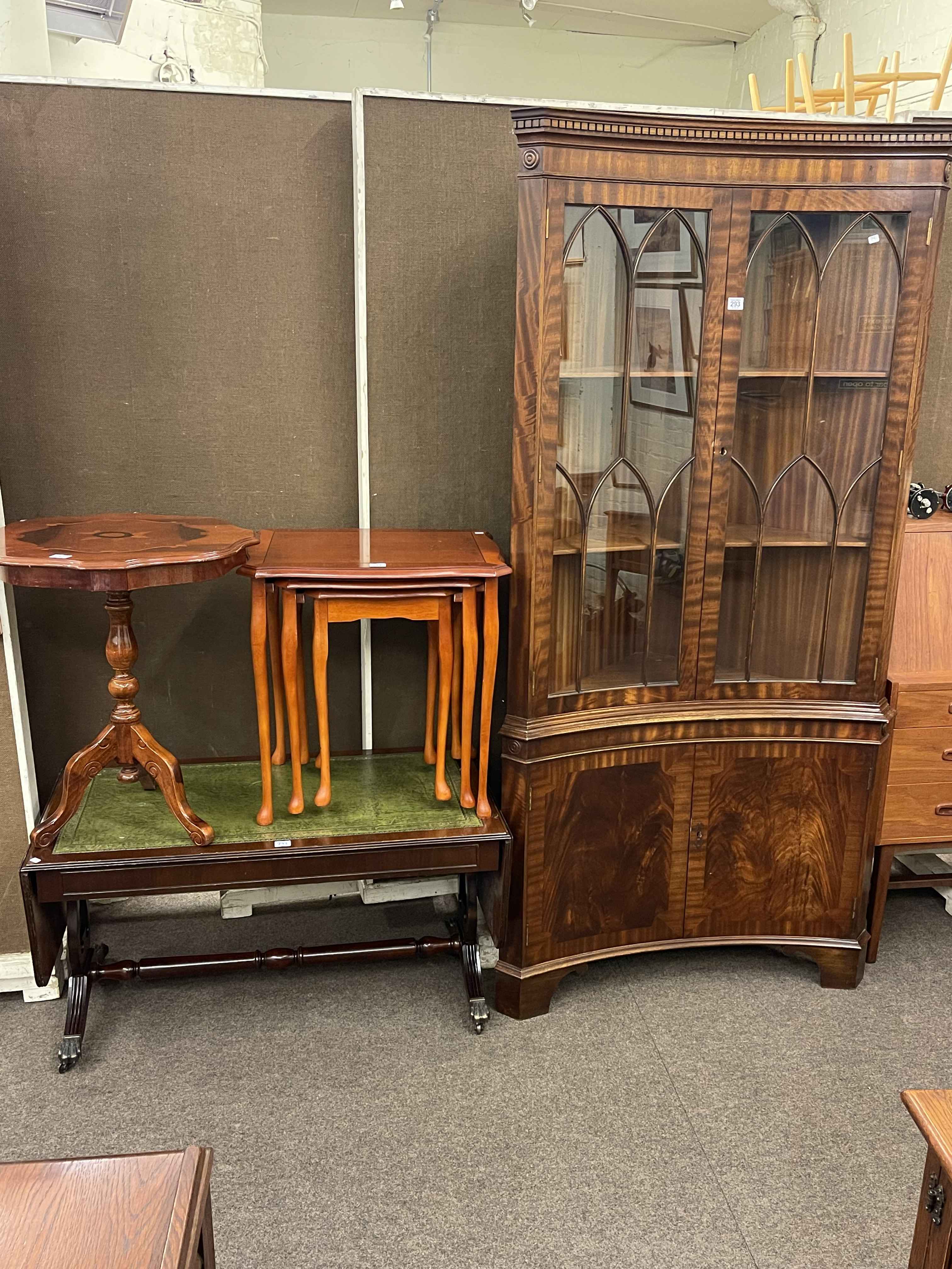 Mahogany four door concave standing corner cabinet, yew nest of three table,