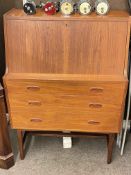 1970's teak three drawer bureau, 108cm by 76.5cm by 41cm.