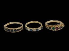 Three 9 carat gold gem set rings.