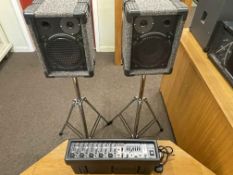 Behringer 5 channel powered mixer with speakers and stands.