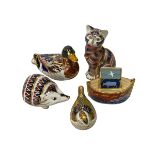 Five Royal Crown Derby paperweights including Hedgehog, Cat and Duck.