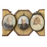 Three oval portrait miniatures, one with easel frame and one cased.