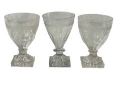 Three Georgian glass rummers with lemon squeezer bases.