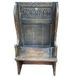 Antique carved oak small wing back settle, 117cm by 66cm by 37cm.