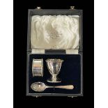 Cased matched silver egg cup, napkin ring and spoon set, Sheffield 1936.