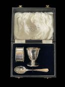 Cased matched silver egg cup, napkin ring and spoon set, Sheffield 1936.