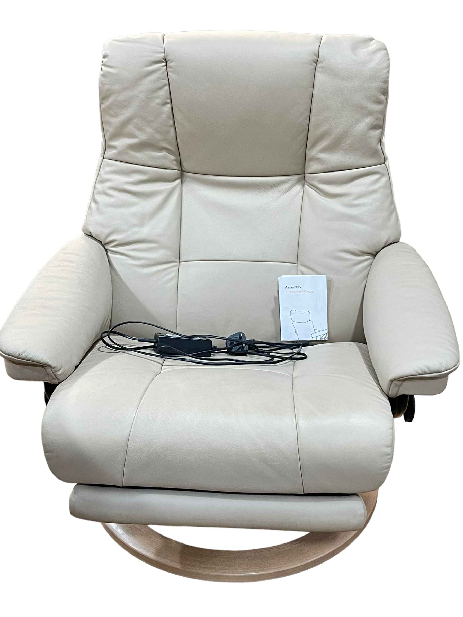 Stressless beige leather electric reclining chair.