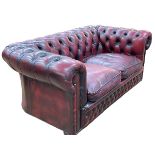 Ox blood deep buttoned leather two seater Chesterfield settee.